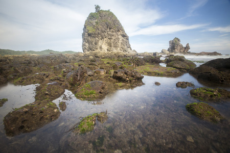 View of Watu Lampung Beach during cloudy day. Nature composition,grain and noise effect,soft focus...