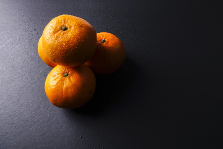 Chinese new year festival decorations,  red packets and mandarin oranges, golden Chinese letter means luckの写真素材