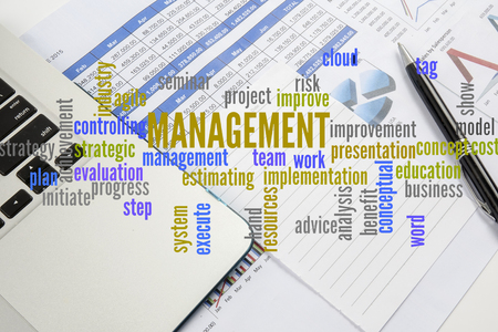 Project management with office stationery  around the word cloud. Analysis and planning keywords.の写真素材