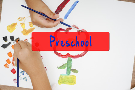 Watercolor and kid drawing on white paper.の写真素材