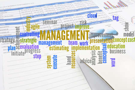 Project management with office stationery  around the word cloud. Analysis and planning keywords.の写真素材