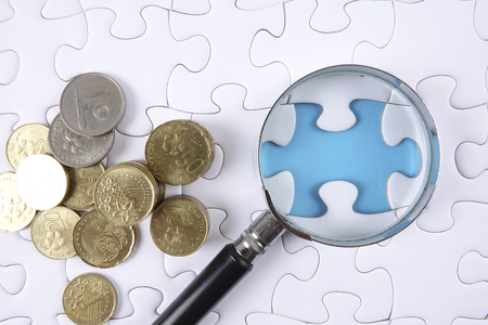 Missing piece of puzzle on white backgroundの写真素材