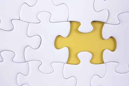 Missing piece of puzzle on white backgroundの写真素材