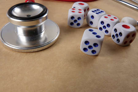 Red stethescope on wooden background. Medical and health care concept.の写真素材