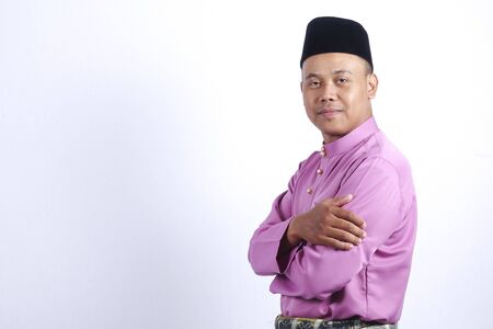 Man in traditional clothing, standing  celebrate Eid Fitr.の写真素材