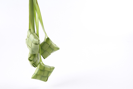 Making of Ketupat, a natural rice casing made from young coconut leaves for cooking riceの写真素材