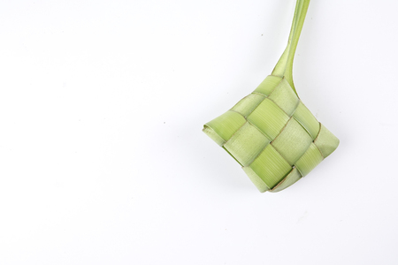 Making of Ketupat, a natural rice casing made from young coconut leaves for cooking riceの写真素材