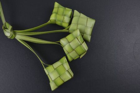 Making of Ketupat, a natural rice casing made from young coconut leaves for cooking riceの写真素材
