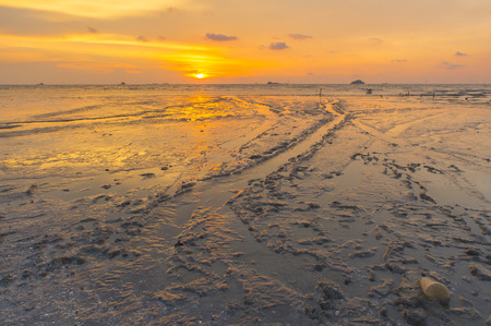 Scenery of sunset captured at Pantai Remis, Selangor, Malaysia. The motion of cloud and water is due to long exposure effect. Low lightの写真素材