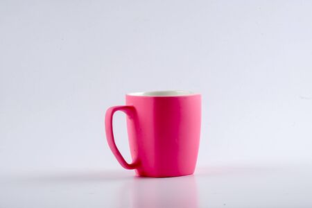 Empty pink mug isoleted on white.の写真素材