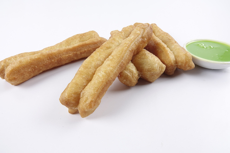Fried bread stick with coconut jam, the bread is also popularly known as Youtiao and Cakoi, a popular Chinese cuisine. The bread is also popular is Southeast Asian countries.の写真素材