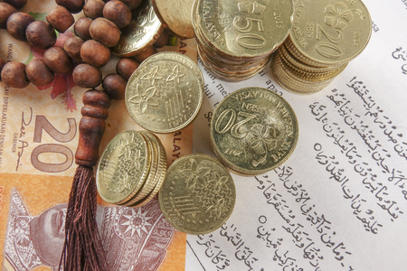 Rosary and coins. Islamic Banking/Finance concept.の写真素材
