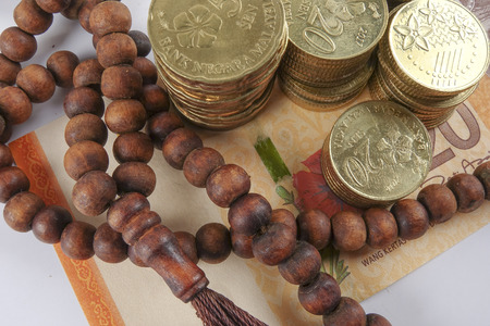 Rosary and coins. Islamic Banking/Finance concept.