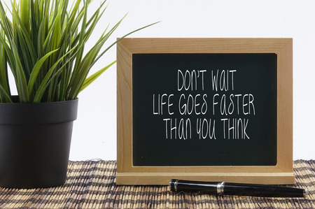 DON'T WAIT, LIFE GOES FASTER THAN YOU THINK.の写真素材