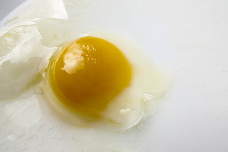 Half boiled egg isolated on white.の写真素材