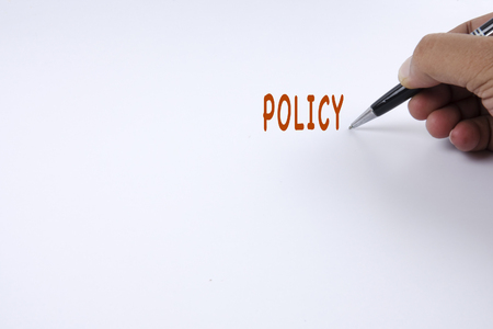 Hand writing with POLICY words.の写真素材