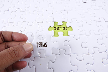 blank jigsaw puzzle with word TERMS  & CONDITIONS.