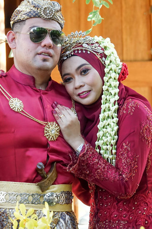 Traditional javanese wedding couple bride and bridegroom at gardenの写真素材