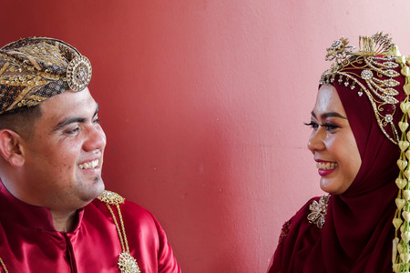 Traditional javanese wedding couple bride and bridegroom at gardenの写真素材