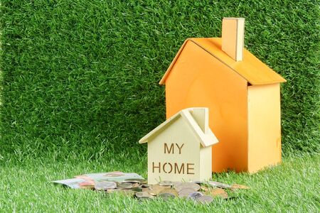 House on the green background. Housing/real estate concept.の写真素材