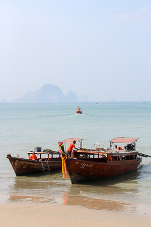 KRABI,THAILAND, MAY 2015. Longtale boats/modern boats at the beautiful beach, Thailand is the popular transportation mode at Krabi Islands, Thailand.のeditorial素材