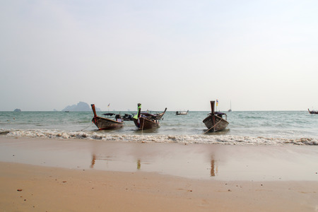 KRABI,THAILAND, MAY 2015. Longtale boats/modern boats at the beautiful beach, Thailand is the popular transportation mode at Krabi Islands, Thailand.のeditorial素材