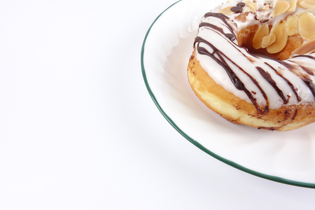 Chocolate peanut donut isolated on whiteの写真素材