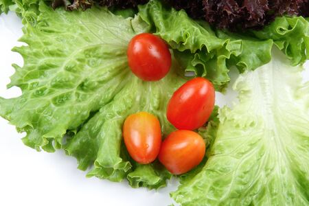Closeup of a pile of lettuce mix for salad on a white backgroundの写真素材