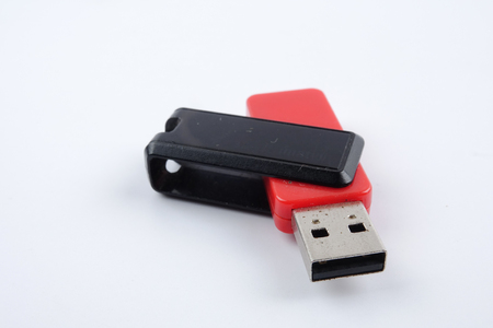 Black and red flash drive isolated on white background.の写真素材