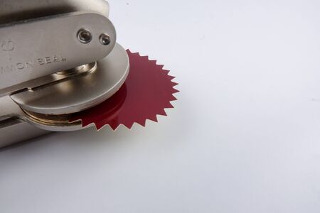 Common seal  and red sticker office stamp isolated on white.
