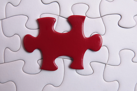 Red puzzle on white background. Copy spaceの写真素材