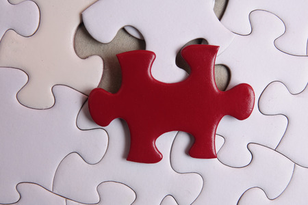 Red puzzle on white background. Copy spaceの写真素材