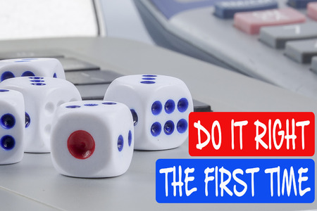 DO IT RIGHT THE FIRST TIME CONCEPT. Dices on the laptop's keybord.の写真素材