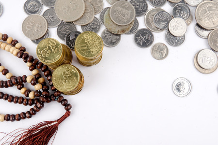 Rosary and coins. Islamic Banking/Finance concept.の写真素材