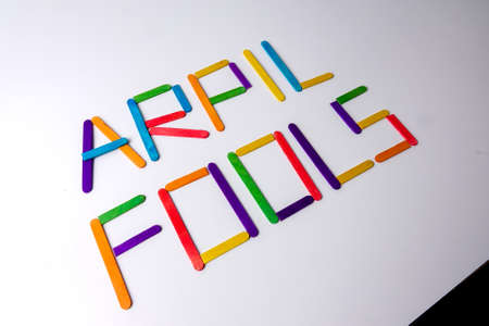 April Fools  background with colourful sticks on white backgroundの写真素材