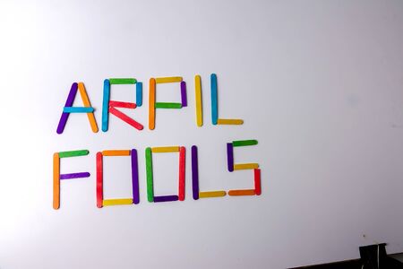 April Fools  background with colourful sticks on white backgroundの写真素材