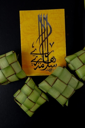 Rice dumpling and money packet decoration for Eid Mubarak celebration.の写真素材