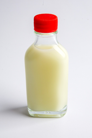 Hot massage oil for manhood therapy isolated on white.の写真素材