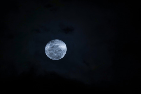 Full moon at dark night. Soft focus and blurred imageの写真素材