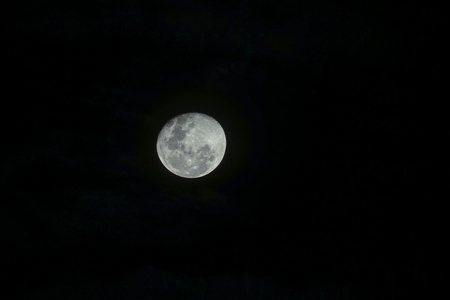 Full moon at dark night. Soft focus and blurred imageの写真素材