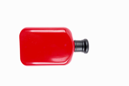 Red man perfume in bottle isolated on whiteの写真素材