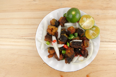 Deep fried eel with chilis,onions and lime.