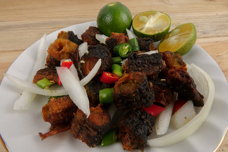 Deep fried eel with chilis,onions and lime.