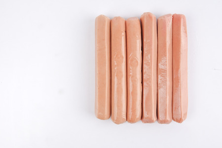 Raw meat sausages isolated on white backgroundの写真素材