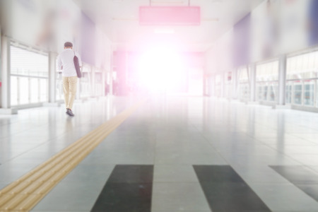 People walking at train station. Blurred backgroundの写真素材