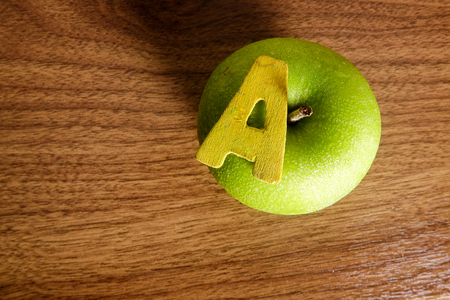 A green apple with alphabet Aの写真素材