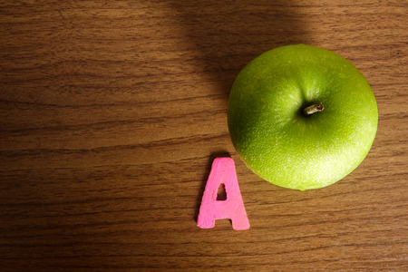 A green apple with alphabet A