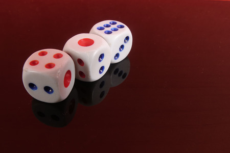 Stacked Dice on a red background