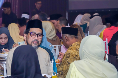 KUALA LUMPUR, 7 JULY 2018. Cheerful unidentify people or crowd attending/celebrating an  asian wedding caremony in Kuala Lumpur.のeditorial素材