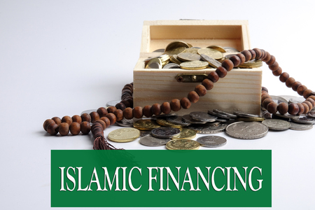 Coins in the wooden box and rosary. Islamic finance/banking conceptの写真素材